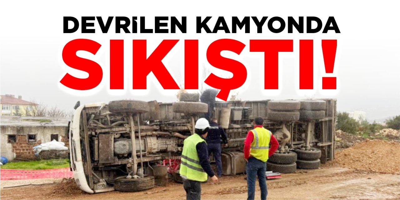 Devrilen kamyonda sıkıştı!