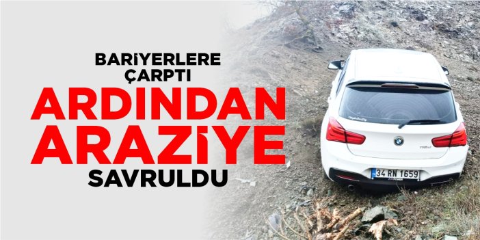Bariyerlere çarpan araç araziye savruldu