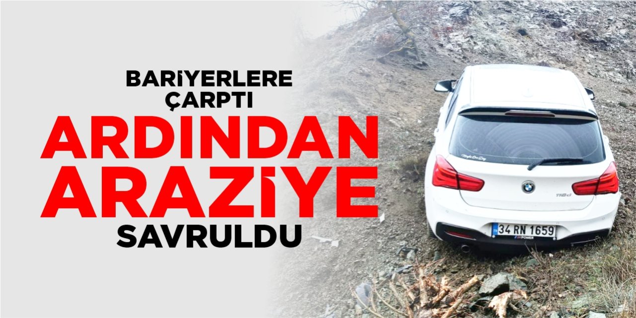 Bariyerlere çarpan araç araziye savruldu