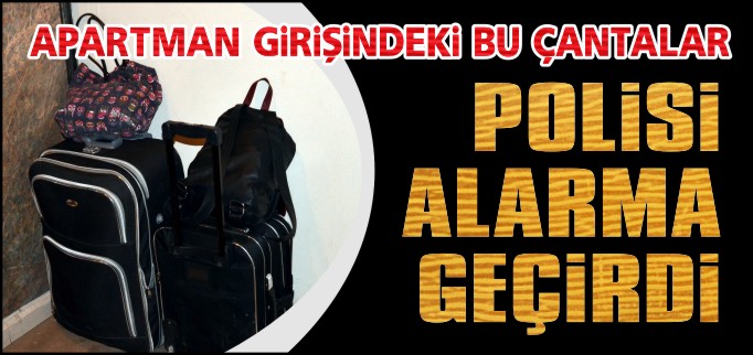 APARTMAN GİRİŞİNDEKİ ÇANTALAR POLİSİ ALARMA GEÇİRDİ