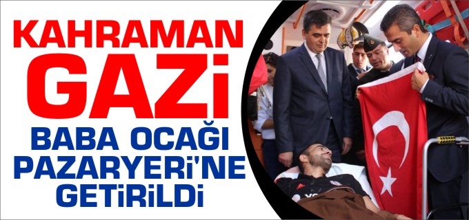 KAHRAMAN GAZİ BAYRAKLARLA KARŞILANDI