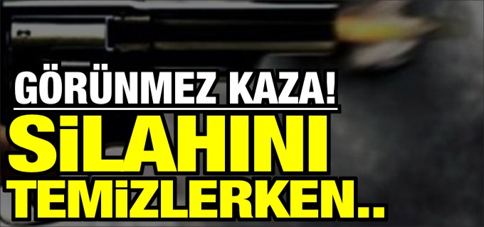 SİLAHINI TEMİZLERKEN ESNAFI YARALADI