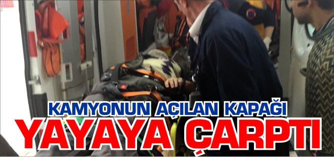 KAMYONUN AÇILAN ARKA KAPAĞI YAYAYA ÇARPTI