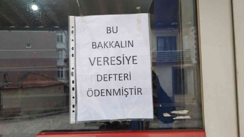 Hayırsever iş insanı bakkalın veresiye defterindeki borçları ödedi